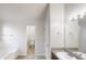 Bright bathroom with a granite vanity, tile floors, a soaking tub and an adjacent toilet room at 1001 Balsam Wood Trl, Villa Rica, GA 30180