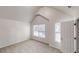 Bedroom with two windows, high ceiling, and carpeted flooring, plus a walk-in closet at 1001 Balsam Wood Trl, Villa Rica, GA 30180
