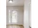 Welcoming entryway with a glass-paneled door and neutral flooring at 1001 Balsam Wood Trl, Villa Rica, GA 30180