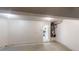 Clean, unfinished two-car garage with access to the home's interior at 1001 Balsam Wood Trl, Villa Rica, GA 30180