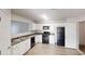 Well-lit kitchen with white cabinets, stainless steel appliances, and modern countertop at 1001 Balsam Wood Trl, Villa Rica, GA 30180