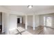 Open-concept living area with modern flooring, leading to the entry and kitchen at 1001 Balsam Wood Trl, Villa Rica, GA 30180