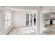 Bright living room with modern gray floors, white trim, and an open layout at 1001 Balsam Wood Trl, Villa Rica, GA 30180