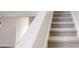 Staircase with carpeted treads and risers at 1001 Balsam Wood Trl, Villa Rica, GA 30180