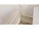 Carpeted staircase featuring white handrail and trim at 1001 Balsam Wood Trl, Villa Rica, GA 30180
