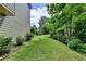 Well-maintained backyard with lush landscaping provides a serene and private outdoor space at 1019 Wolf Springs Ct, Lawrenceville, GA 30043