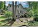 Lovely backyard features a large deck and mature trees for privacy and outdoor enjoyment at 1019 Wolf Springs Ct, Lawrenceville, GA 30043