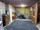Spacious unfinished basement with concrete walls and exposed wood beams and floor; great for storage at 1019 Wolf Springs Ct, Lawrenceville, GA 30043