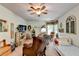 Comfortable bedroom with ceiling fan, sitting area, and abundant natural light at 1019 Wolf Springs Ct, Lawrenceville, GA 30043