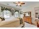 Comfortable bedroom with natural light, carpet flooring, and modern decor at 1019 Wolf Springs Ct, Lawrenceville, GA 30043