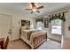 Comfortable bedroom with a cozy bed, window views, and carpet flooring at 1019 Wolf Springs Ct, Lawrenceville, GA 30043