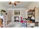 Bright bedroom featuring carpet flooring, a desk, and natural light at 1019 Wolf Springs Ct, Lawrenceville, GA 30043