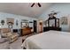 Bedroom featuring a four-poster bed, vaulted ceiling, and carpet flooring at 1019 Wolf Springs Ct, Lawrenceville, GA 30043