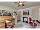 Spacious bedroom featuring a desk, ample natural light, and carpet flooring at 1019 Wolf Springs Ct, Lawrenceville, GA 30043