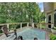 Comfortable deck with furniture, green views, and stylish railings providing a peaceful retreat at 1019 Wolf Springs Ct, Lawrenceville, GA 30043