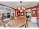Open-concept dining room with view to living area, featuring classic decor and finishes at 1019 Wolf Springs Ct, Lawrenceville, GA 30043