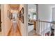 Upstairs hallway leading to bedroom with carpet and ceiling fan at 1019 Wolf Springs Ct, Lawrenceville, GA 30043