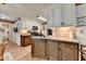 Kitchen features modern appliances, granite countertops and wood-look floors at 1019 Wolf Springs Ct, Lawrenceville, GA 30043
