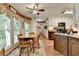 Eat in kitchen with updated appliances, granite countertops, and wood look floors at 1019 Wolf Springs Ct, Lawrenceville, GA 30043