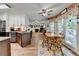 Kitchen and breakfast nook with updated cabinetry, granite countertops, and wood-look floors at 1019 Wolf Springs Ct, Lawrenceville, GA 30043