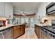 Bright kitchen with granite countertops, stainless steel appliances, and a view to the dining area at 1019 Wolf Springs Ct, Lawrenceville, GA 30043