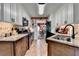 Updated kitchen featuring granite countertops, stainless appliances and white cabinets at 1019 Wolf Springs Ct, Lawrenceville, GA 30043