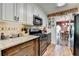 Kitchen features granite countertops, stainless steel appliances, and modern cabinetry at 1019 Wolf Springs Ct, Lawrenceville, GA 30043
