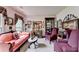 Cozy living room featuring charming vintage furniture, decor and plenty of natural light at 1019 Wolf Springs Ct, Lawrenceville, GA 30043