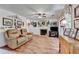 Comfortable living room with fireplace, ceiling fan and access to stairs at 1019 Wolf Springs Ct, Lawrenceville, GA 30043