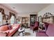 Cozy living room offering classic decor, comfortable seating, and an abundance of natural light at 1019 Wolf Springs Ct, Lawrenceville, GA 30043