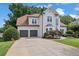 Elegant two-story home featuring a spacious driveway and attached two-car garage at 1430 Grovehurst Dr, Marietta, GA 30062