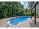 Sparkling pool surrounded by lush greenery providing a private outdoor oasis at 1430 Grovehurst Dr, Marietta, GA 30062