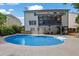 Beautiful pool with outdoor patio seating, screened-in porch and landscaped yard at 1430 Grovehurst Dr, Marietta, GA 30062