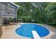 Gorgeous pool features a diving board, screened porch and spacious outdoor patio at 1430 Grovehurst Dr, Marietta, GA 30062