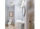 Bright bathroom with a pedestal sink, large mirror, and a glass-enclosed shower at 195 14Th St # 902, Atlanta, GA 30309