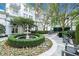 Beautiful courtyard with a fountain, lush greenery, and seating areas offers a serene outdoor retreat at 195 14Th St # 902, Atlanta, GA 30309