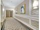 Hallway with decorative panels, patterned carpeting, and elegant sconces, leading to various suites at 195 14Th St # 902, Atlanta, GA 30309