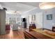 Open-concept living room with a dining area, light gray walls, and wood floors throughout at 195 14Th St # 902, Atlanta, GA 30309