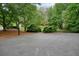 Private outdoor basketball court nestled in a wooded area at 3267 Standing Peachtree Trl, Kennesaw, GA 30152