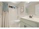Bathroom with a tub and shower combo, white tiling, vanity, and a blue shower curtain at 3267 Standing Peachtree Trl, Kennesaw, GA 30152