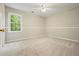 Spacious bedroom with a large window providing natural light and a soothing ambiance at 3267 Standing Peachtree Trl, Kennesaw, GA 30152