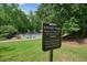 Sign indicating the location of the nature trail, pool, and tennis courts for residents of the community at 3267 Standing Peachtree Trl, Kennesaw, GA 30152