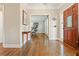 Inviting entryway with hardwood floors, wood door with glass window, and views to the office at 3267 Standing Peachtree Trl, Kennesaw, GA 30152