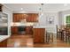 Kitchen featuring stainless steel appliances, center island, and beautiful hardwood floors at 3267 Standing Peachtree Trl, Kennesaw, GA 30152