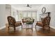 Bright living room featuring a fireplace, hardwood floors, ceiling fan, and neutral decor at 3267 Standing Peachtree Trl, Kennesaw, GA 30152
