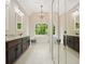 Elegant main bathroom with double vanity, soaking tub and bright windows at 3267 Standing Peachtree Trl, Kennesaw, GA 30152