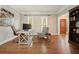 Office with hardwood floors, large window, and a view to the entryway at 3267 Standing Peachtree Trl, Kennesaw, GA 30152