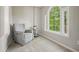 Cozy sitting room featuring a comfortable armchair and scenic views at 3267 Standing Peachtree Trl, Kennesaw, GA 30152