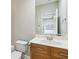 Bathroom featuring a wood vanity, neutral walls, and a large mirror for a clean and modern look at 5933 Brookside Oak Cir, Norcross, GA 30093