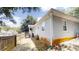 Exterior view showcasing the home's backyard with a small porch, and a wooden fence at 71 Thayer Se Ave, Atlanta, GA 30315